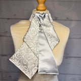 silver satin pattered equestrian ready tied stock tie on a mannequin 