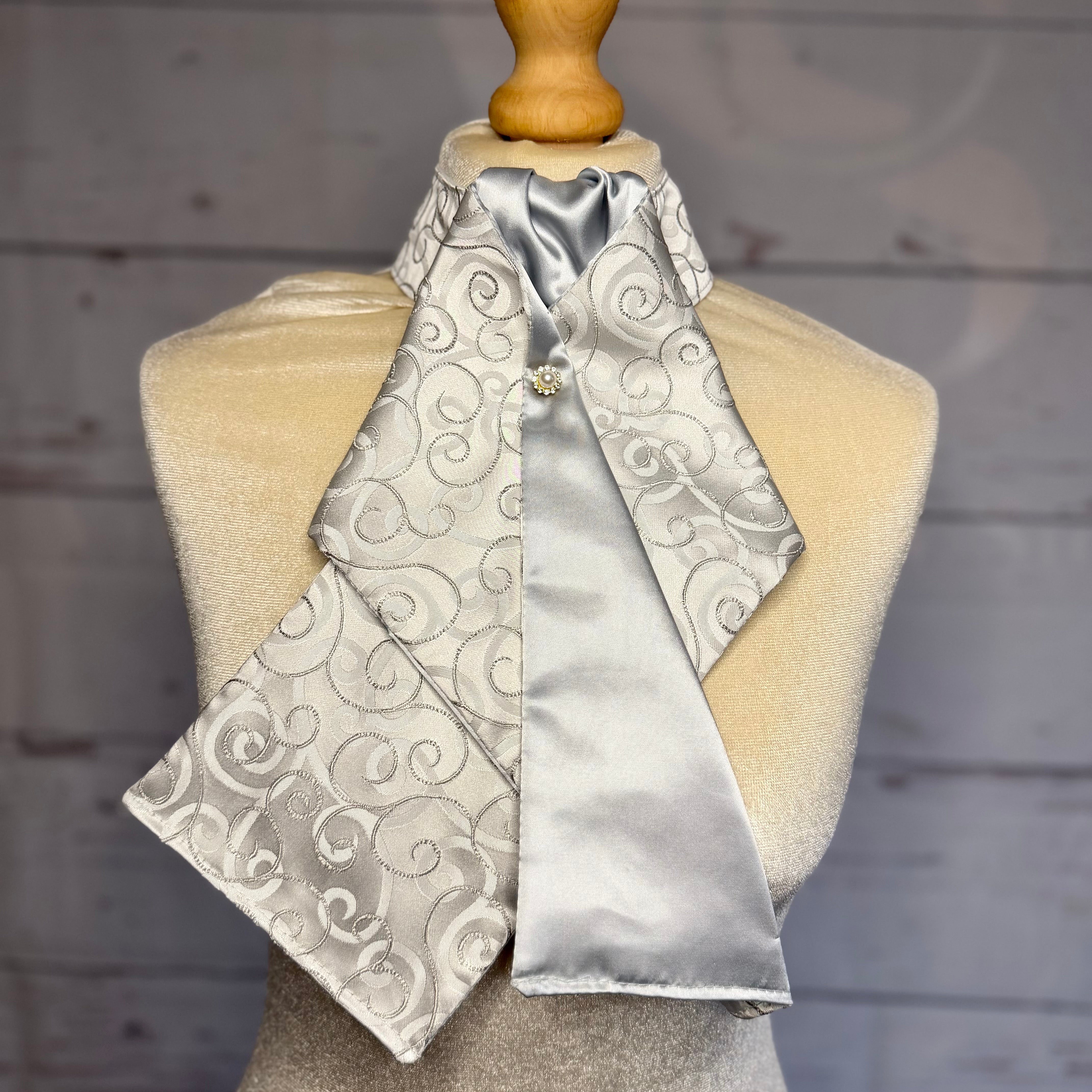 silver satin pattered equestrian ready tied stock tie on a mannequin 