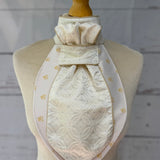 champagne equestrian stock tie with gold piping on a mannequin 