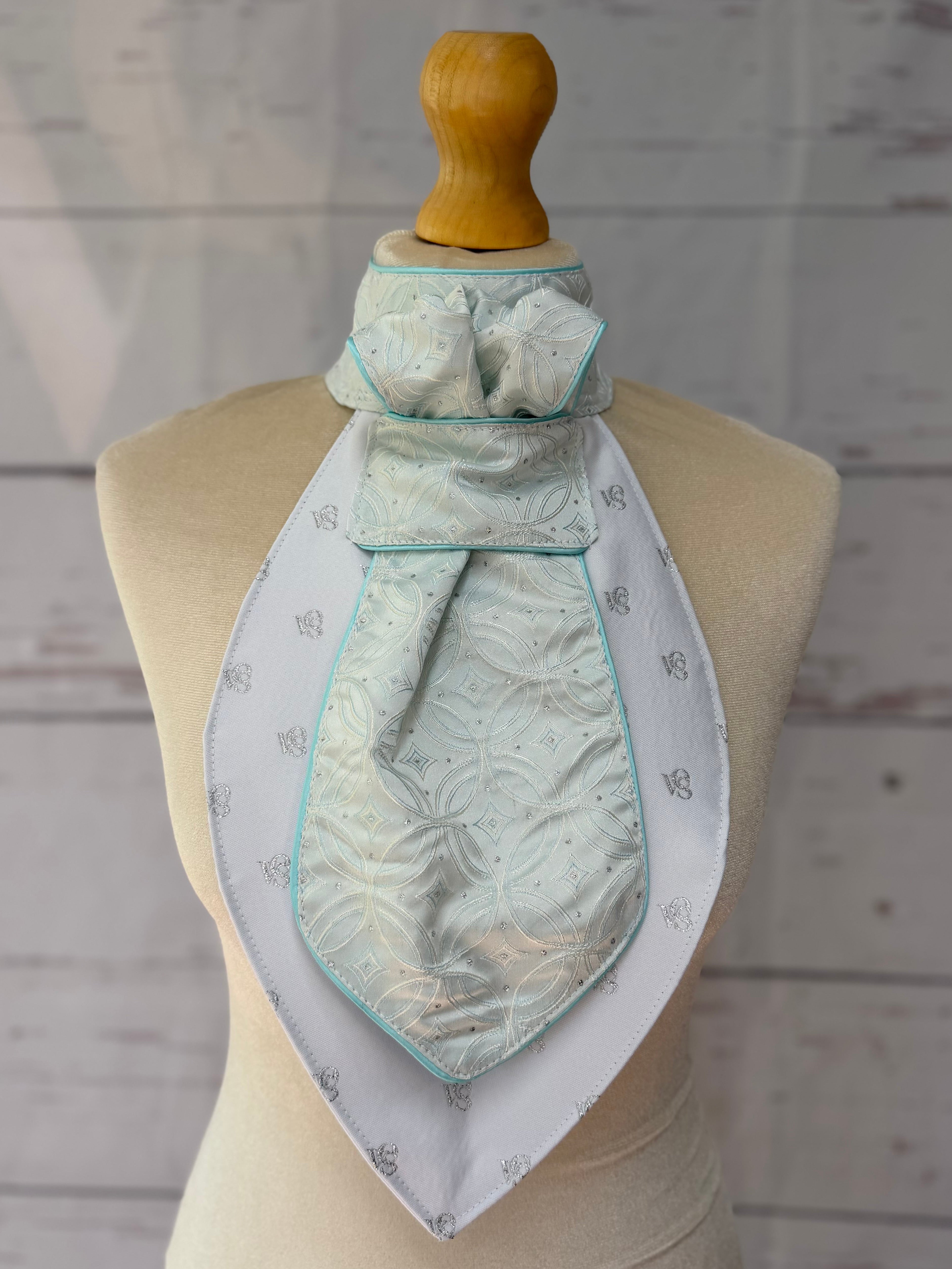 an aqua equestrian stock tie on a mannequin 