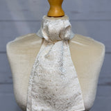 mannequin wearing gold and white stock tie 