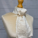 mannequin wearing a white and gold stock tie 