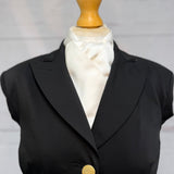black jacket on mannequin with satin white stock tie 